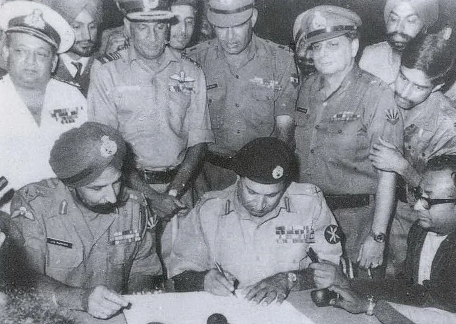 Lt. Gen. Niazi signing the Instrument of Surrender while Lt. Gen. Aurora looks on, Dhaka, December 16, 1971