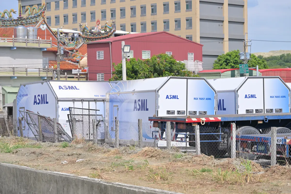 ASML air freight containers on trucks in Tainan, Taiwan, with a temple in the background