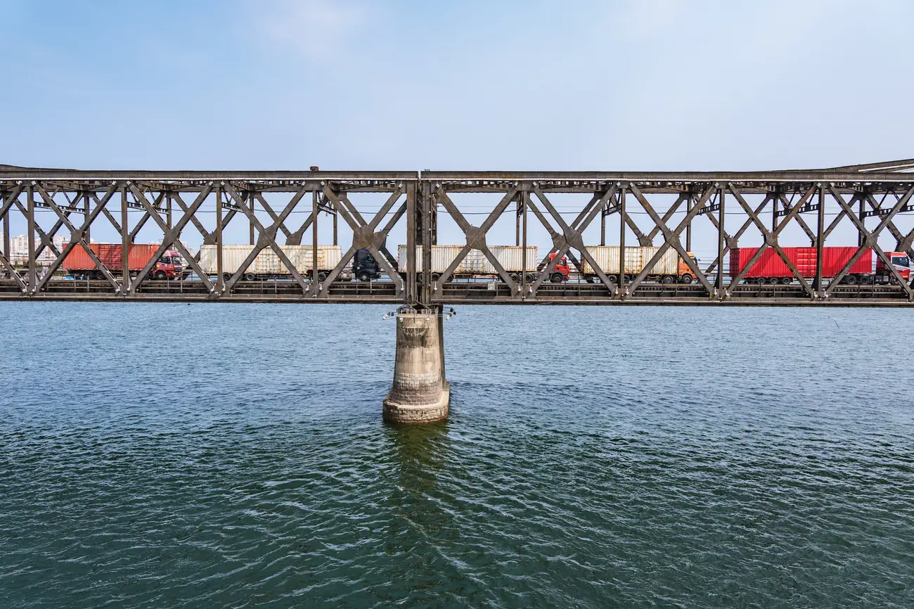 Cargo trucks crossing the Sino-Korean Friendship Bridge between Dandong and Sinuiju