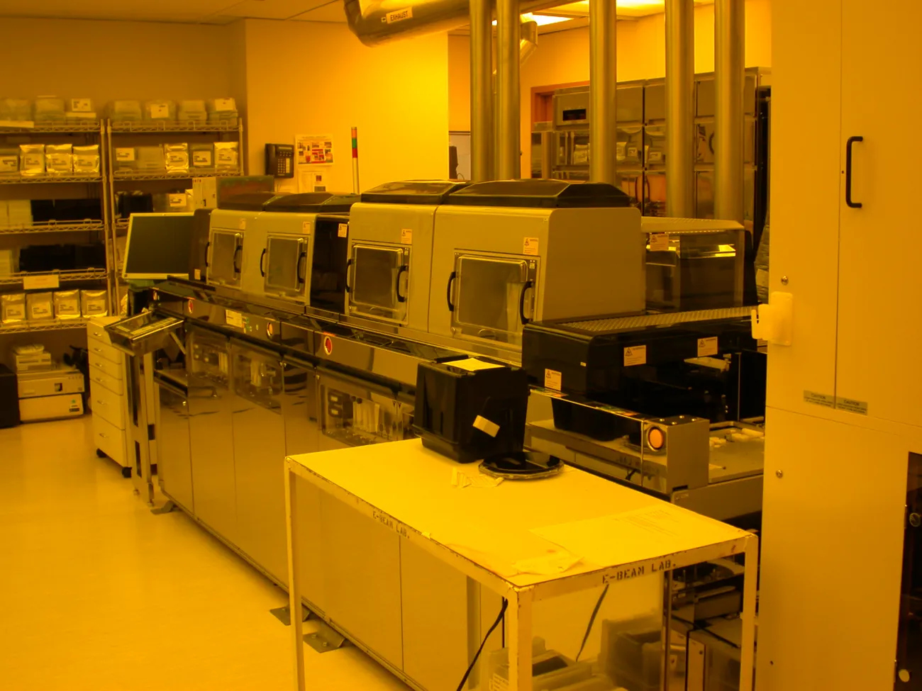 Semiconductor cleanroom equipment lit in amber safety light