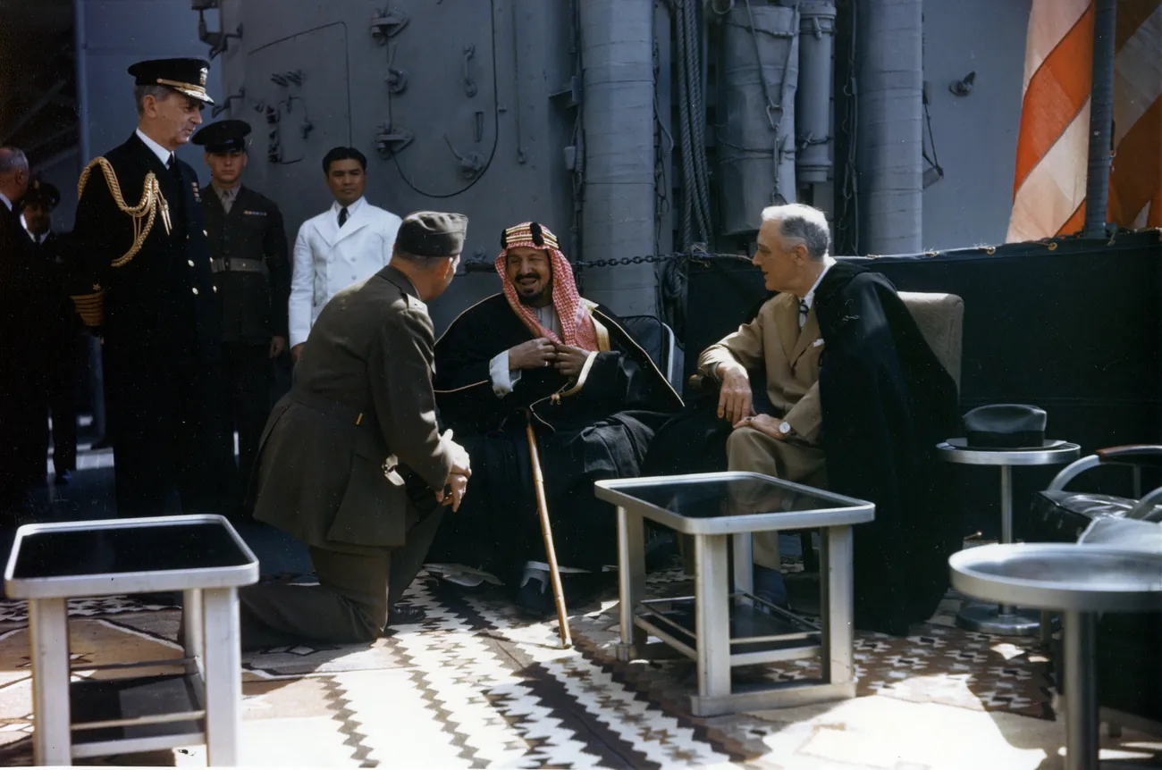 Franklin Roosevelt and King Abdulaziz Ibn Saud seated aboard the USS Quincy