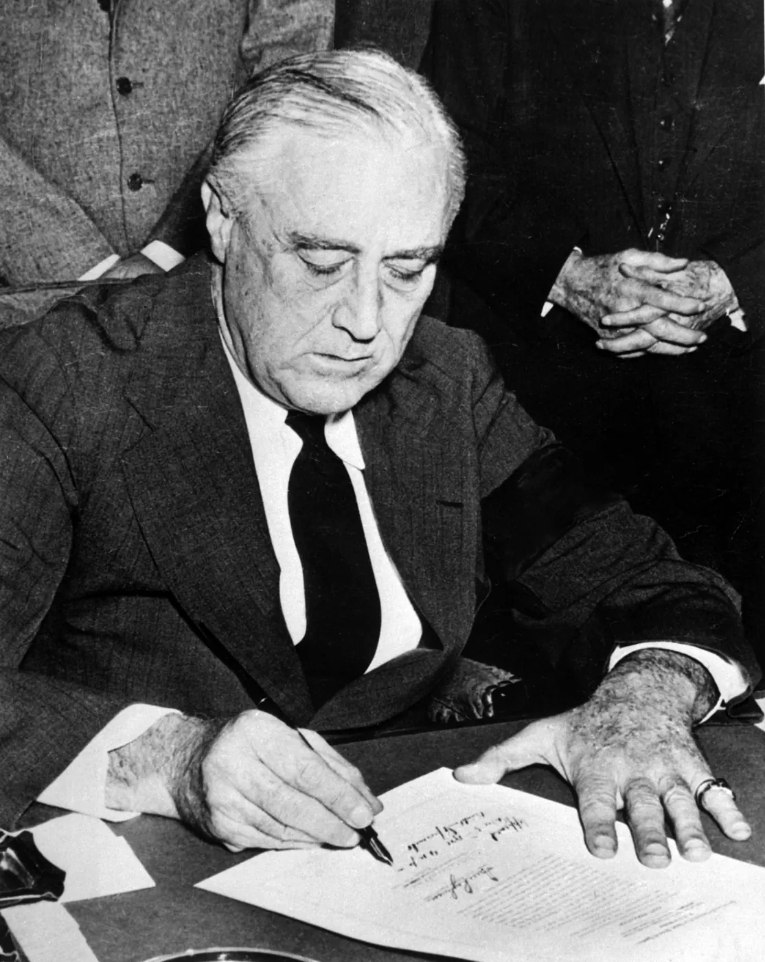 President Franklin D. Roosevelt signing the declaration of war against Japan, December 8, 1941