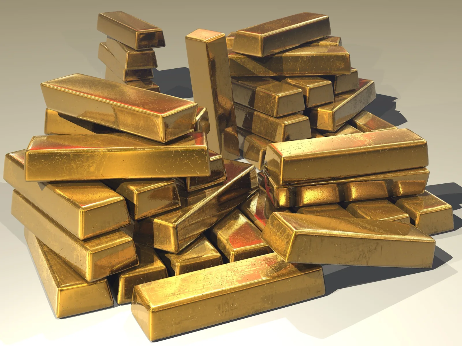 A stack of gold bullion bars, the kind held in central bank reserves