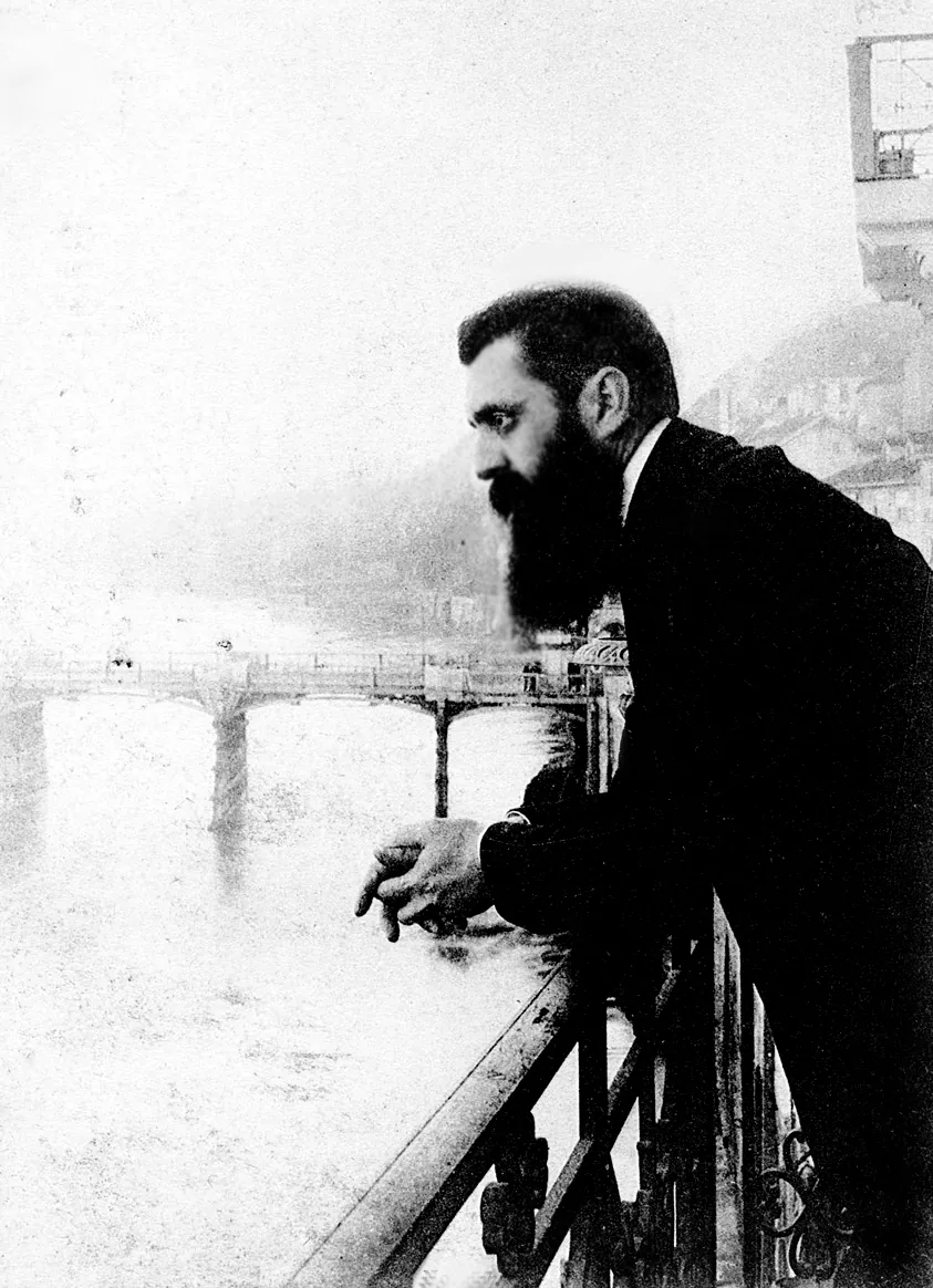 Theodor Herzl leaning over a hotel balcony railing in Basel