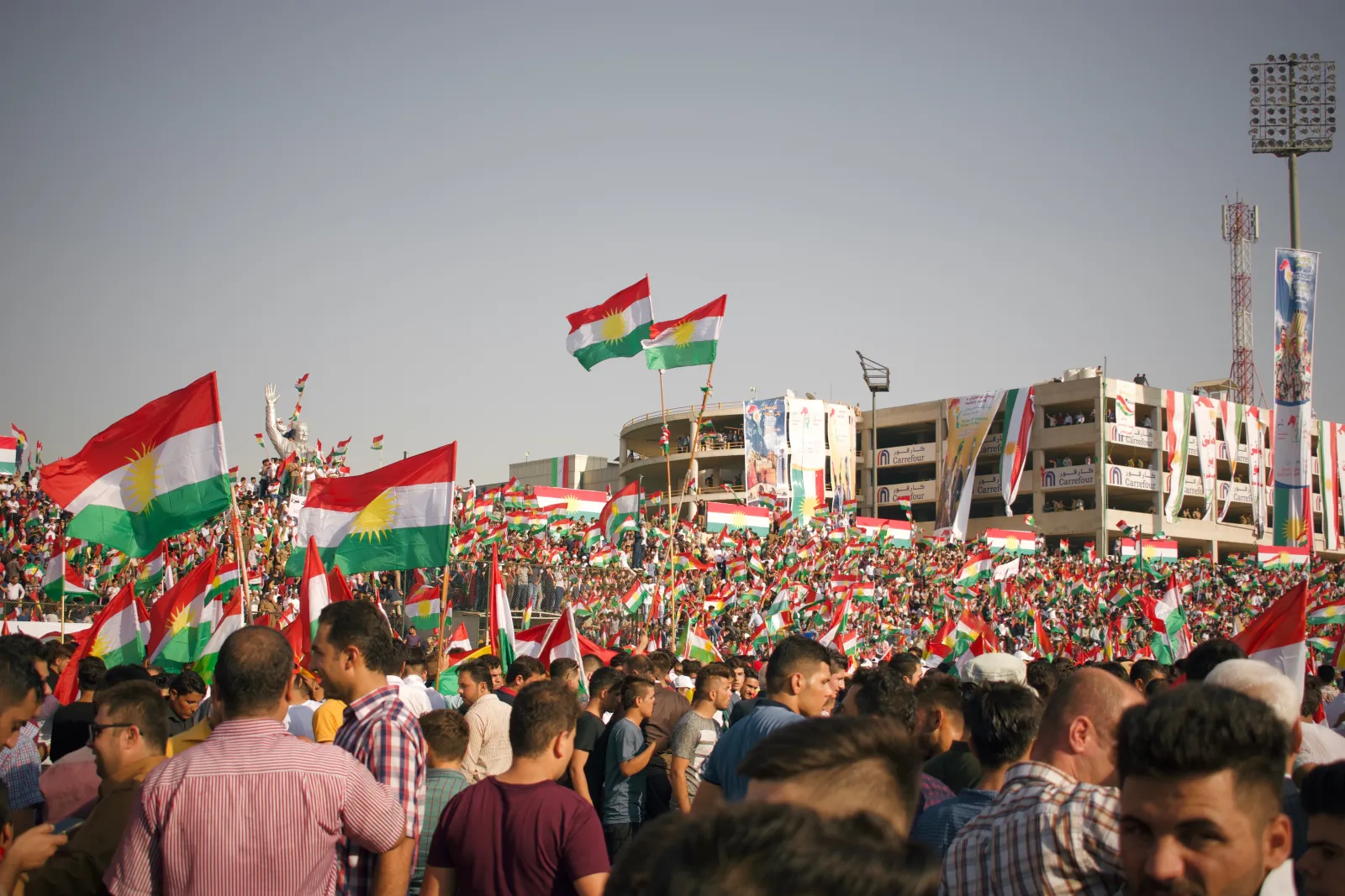 Thousands of people wave Kurdish flags at a pro-independence rally in Franso Hariri Stadium in Erbil, three days before the 2017 referendum
