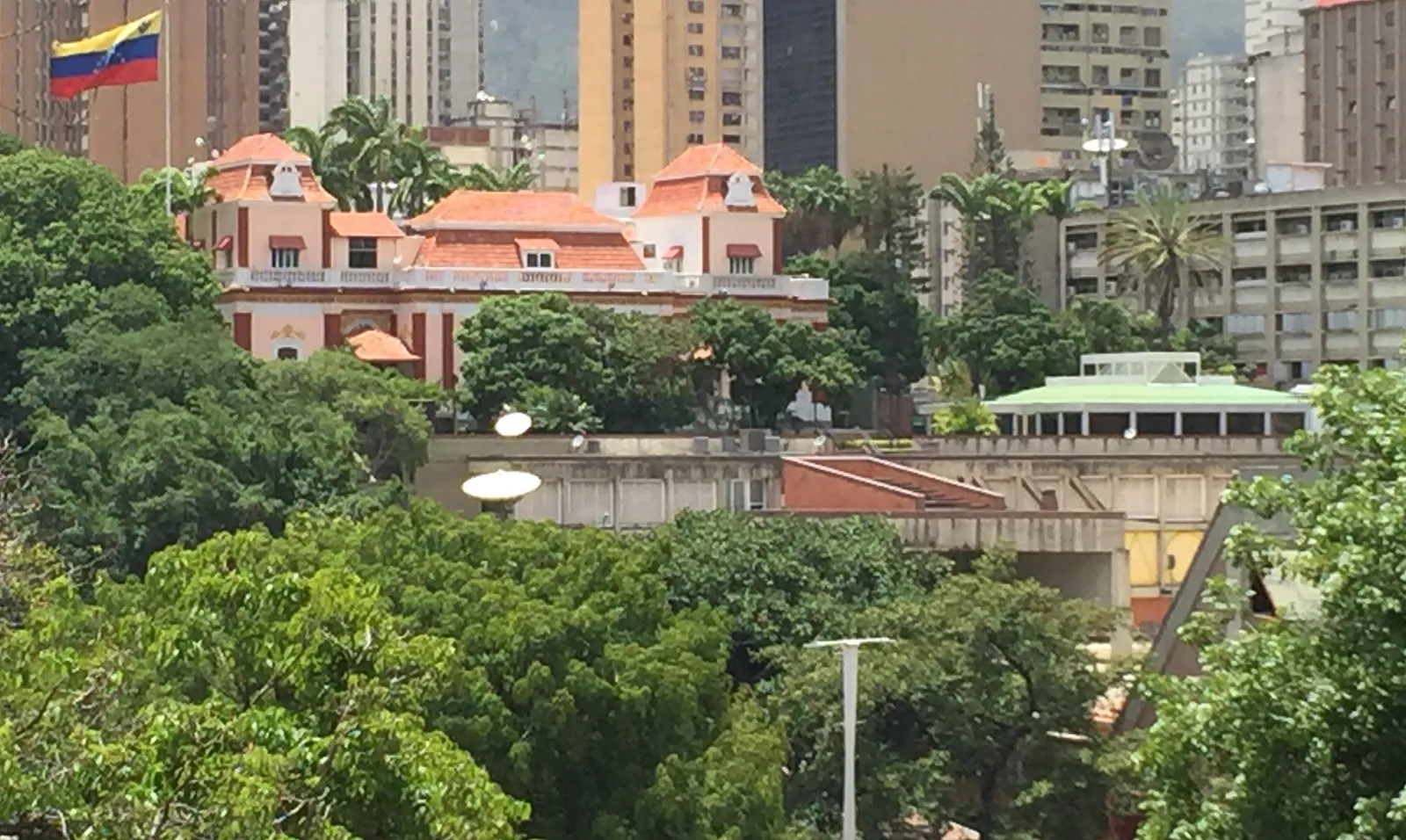 Miraflores Palace, the white presidential palace of Venezuela, seen from a hillside park in Caracas