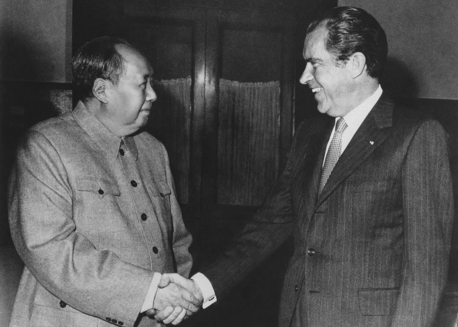 Richard Nixon shaking hands with Mao Zedong in Beijing, February 1972