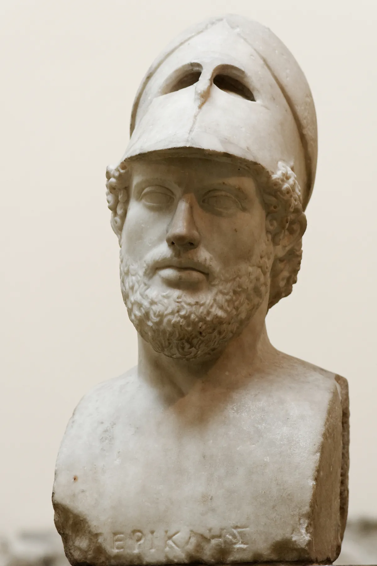 Marble bust of Pericles wearing a Corinthian helmet pushed back on his head