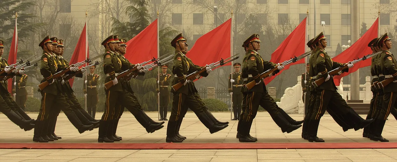 A column of Chinese People's Liberation Army honor-guard soldiers marching in formation