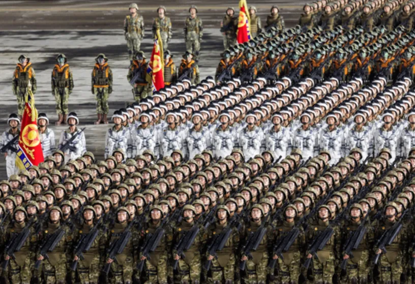 Rows of soldiers in historical uniforms and modern military vehicles in Kim Il-sung Square, Pyongyang, during the 2023 Victory Day parade