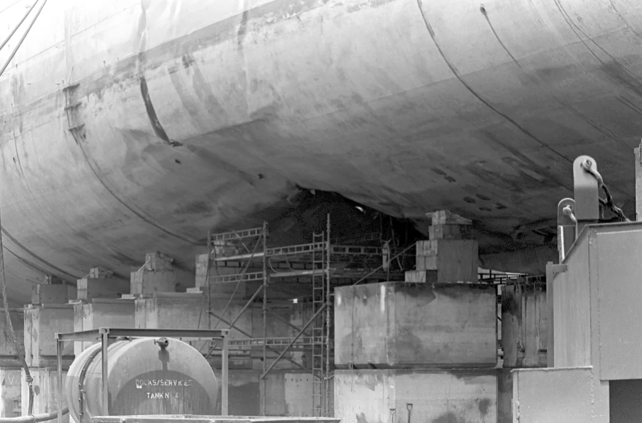 The hull of USS Samuel B. Roberts propped up in drydock