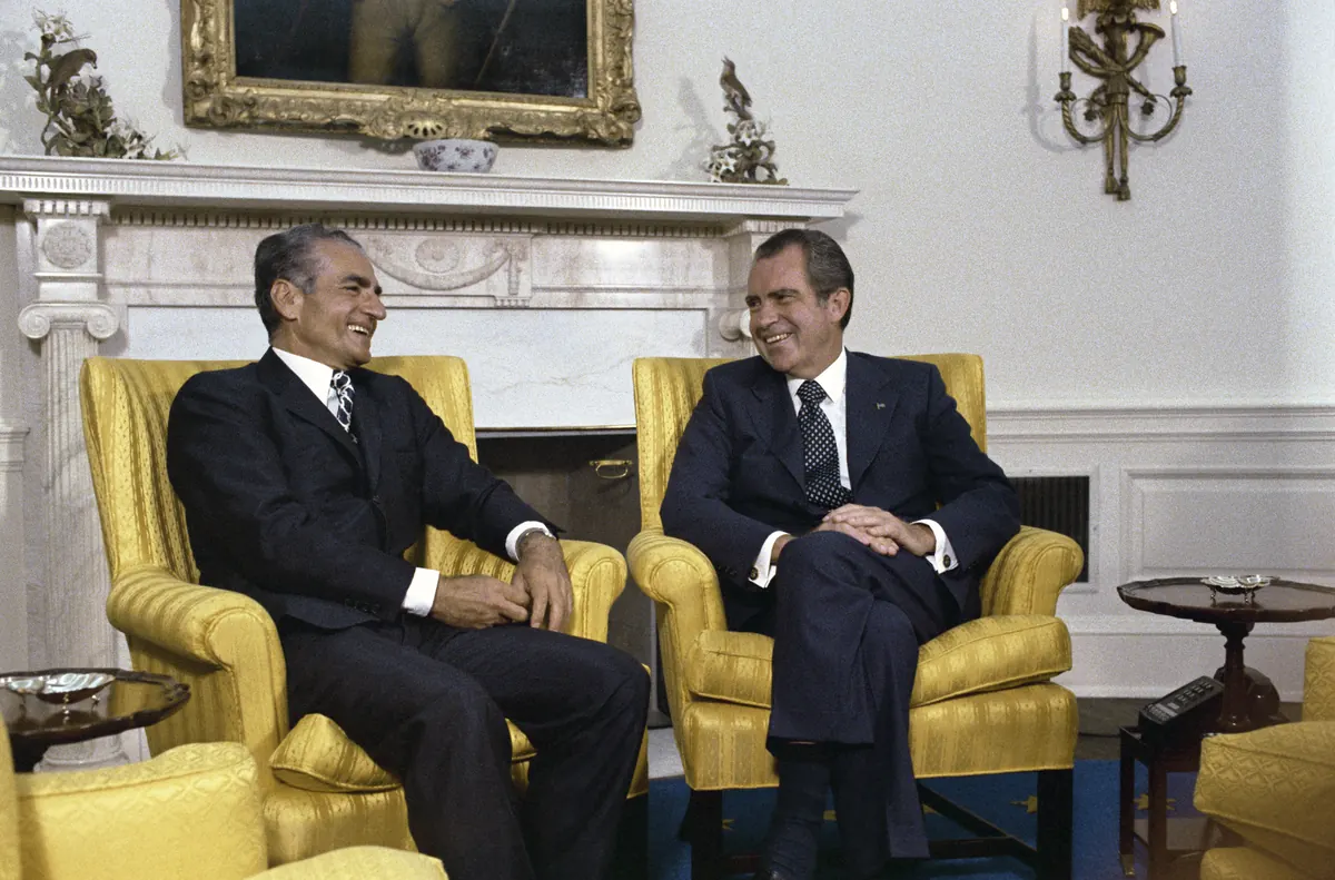 The Shah and President Nixon seated in the Oval Office