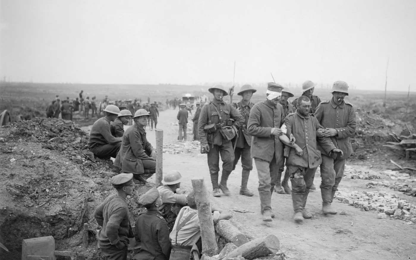 British soldiers watch wounded German prisoners pass near the Somme
