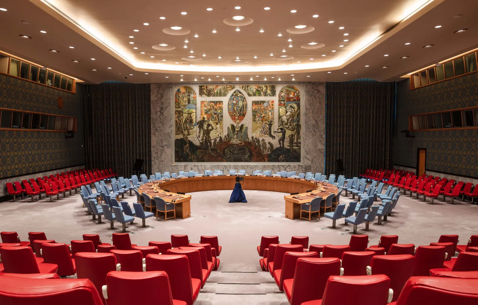 The UN Security Council chamber in New York, with its horseshoe-shaped table and mural backdrop