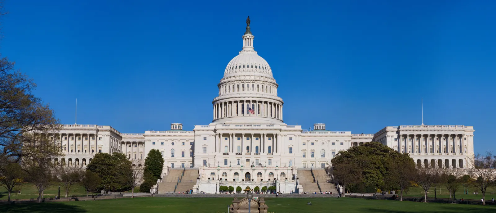 The west front of the United States Capitol building in Washington, D.C., under a clear sky