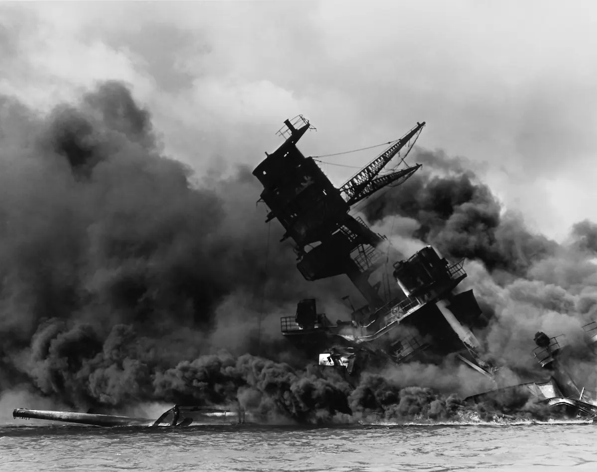 The USS Arizona burning after the Japanese attack on Pearl Harbor, December 7, 1941