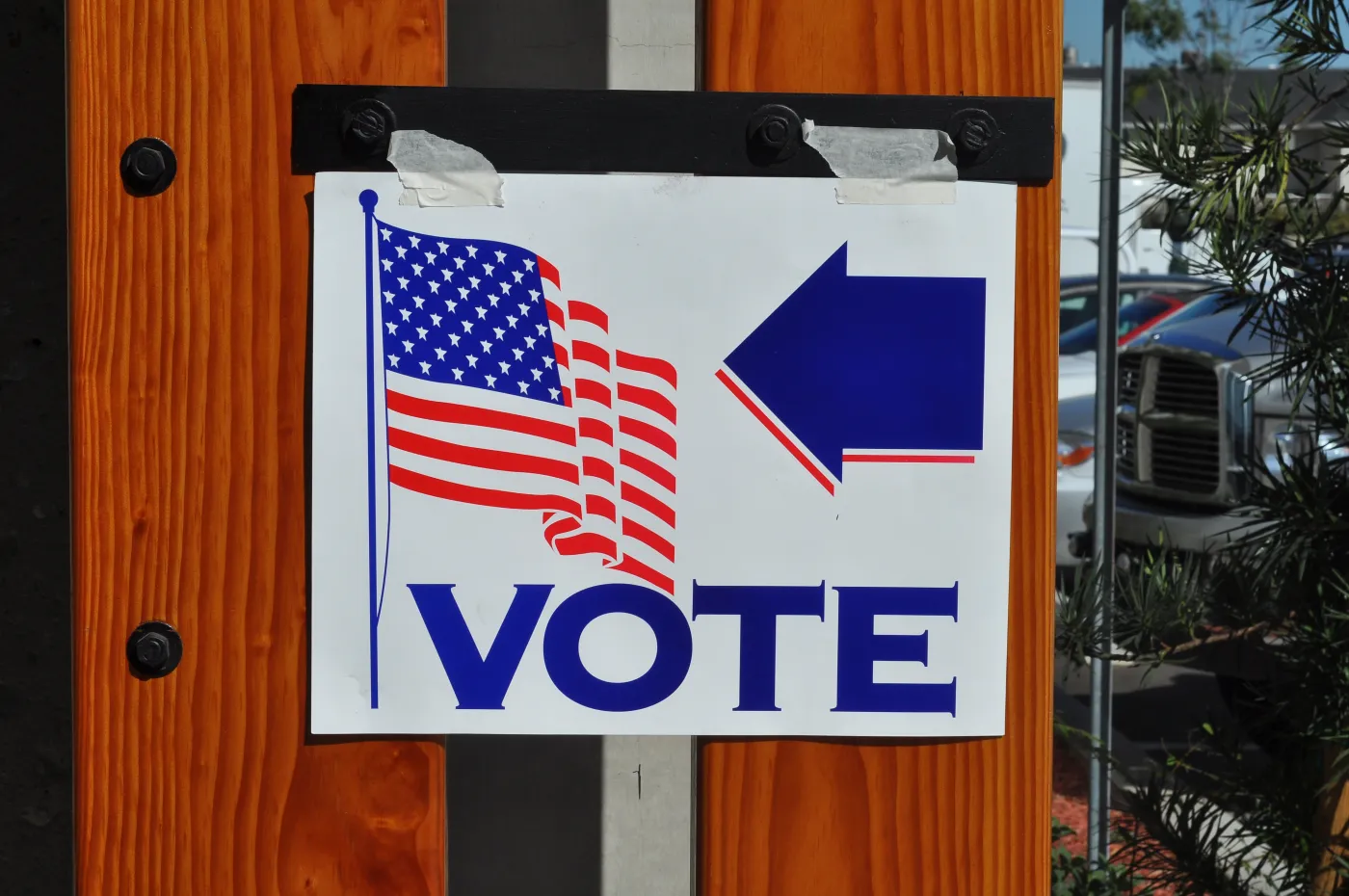 Voters standing at voting booths in an American polling station