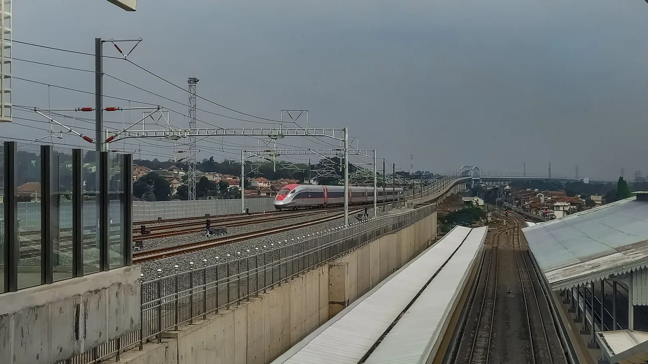 The Whoosh high-speed train approaching a station near Bandung, Indonesia