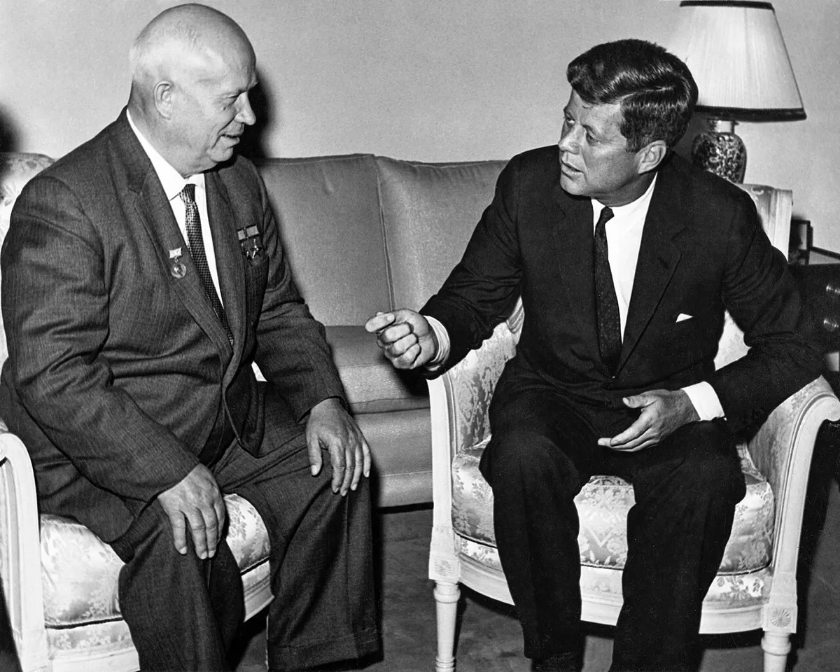 Nikita Khrushchev and John F. Kennedy talking in armchairs during their meeting in Vienna, June 1961