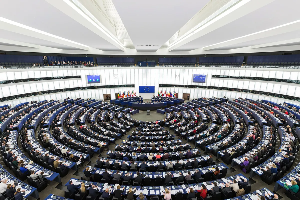 The round debating chamber of the European Parliament in Strasbourg, full of members during a session