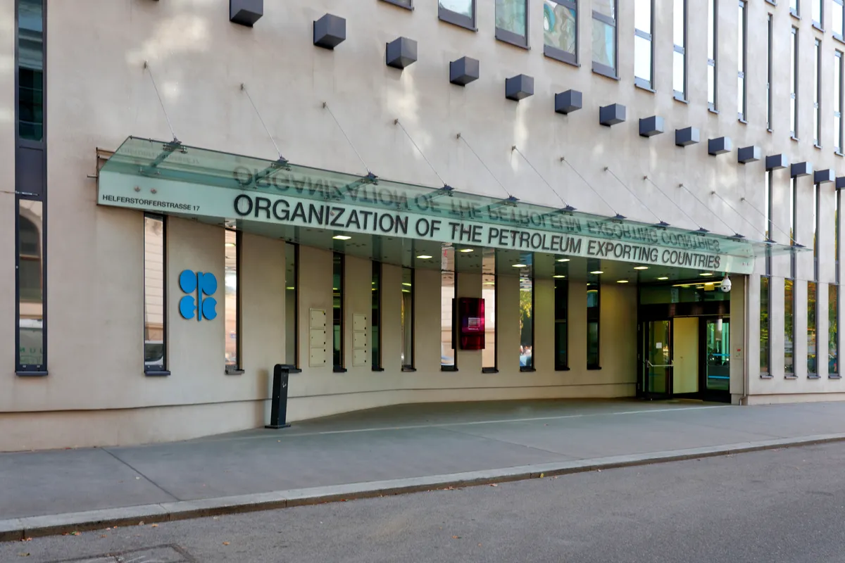The entrance of OPEC's headquarters in Vienna, with the organization's full name in large letters on a glass canopy over the door