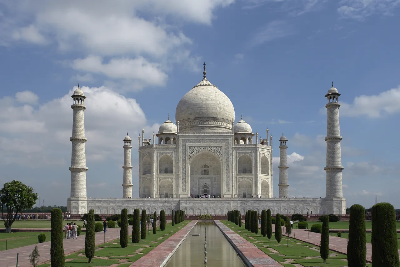The Taj Mahal in Agra seen from its gardens, with the long reflecting pool in front