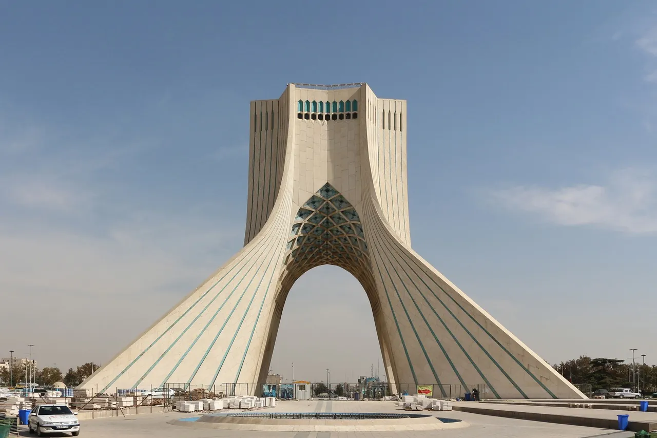 The Azadi Tower in Tehran under a blue sky