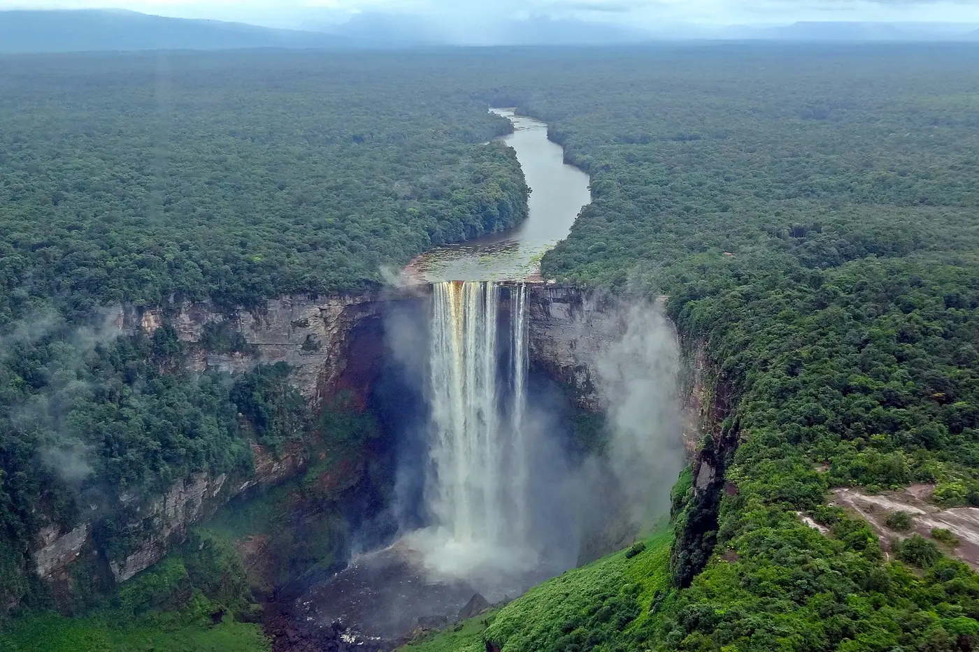 Kaieteur Falls dropping into a gorge in the rainforest, seen from a plane