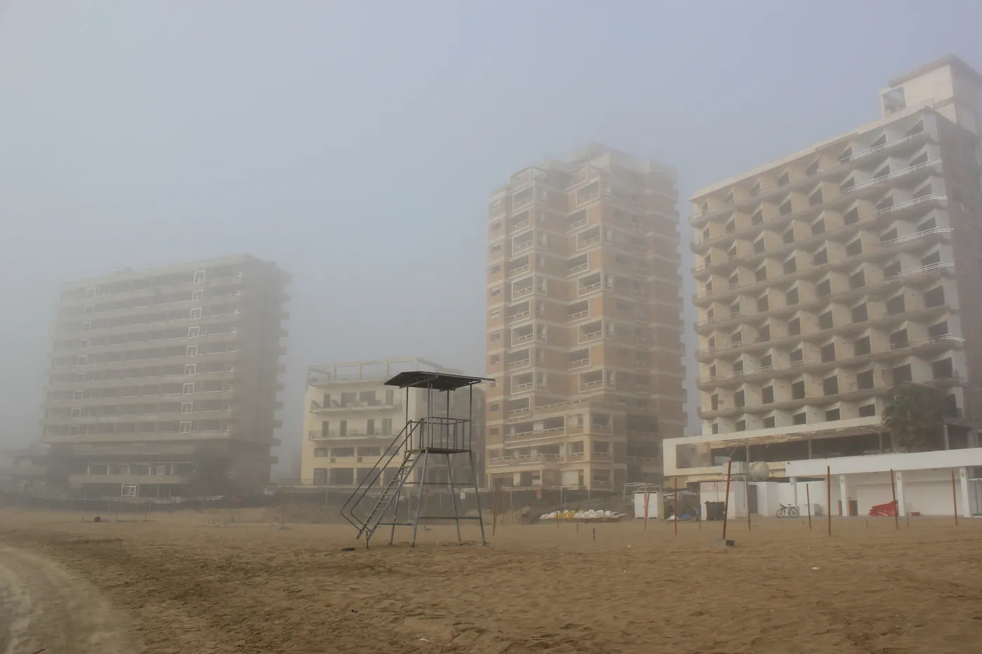 Empty high-rise hotels on the beach at Varosha on a foggy day