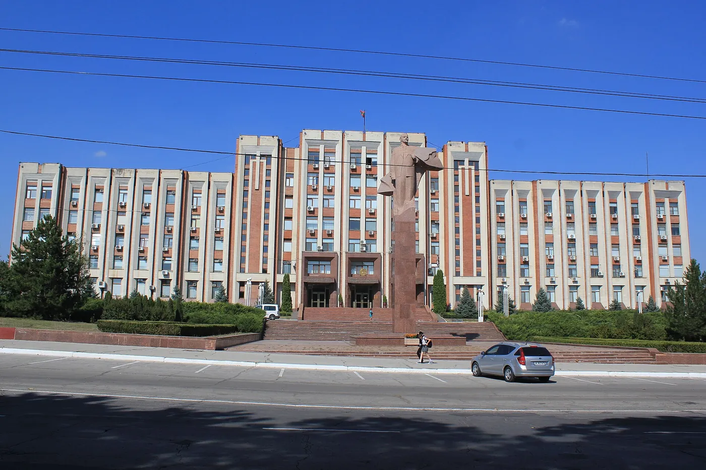 The Supreme Council building in Tiraspol with a red granite statue of Lenin in front of it